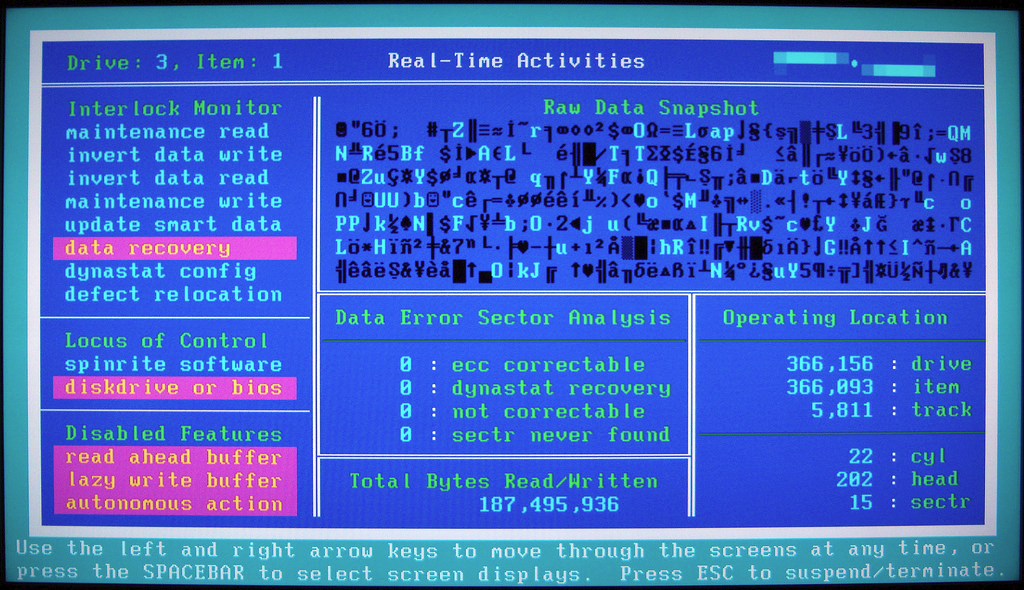a photo of a screen showing some disc analysis utility running on DOS, with
lots of text and gfx on a blue background