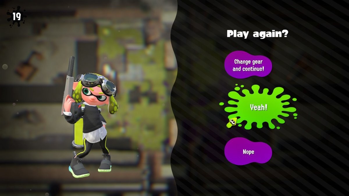 a Splatoon 2 screenshot with a squid girl with an N-ZAP, a set of goggles,
and a black jumper with a white t-shirt
underneath.